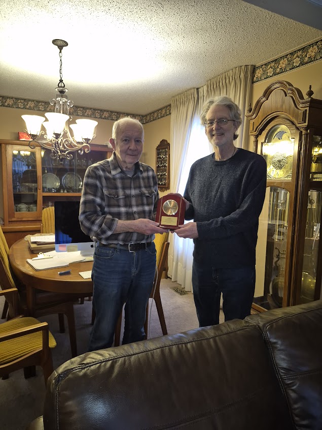Cam Presenting Doug with his 80th Birthday gift from the Club Members.